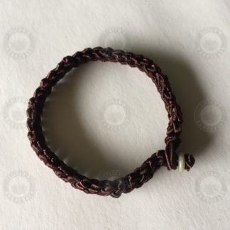 Brown bracelet with jade button and evil-evading knot