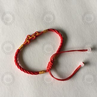 Red bracelet with lucky knot