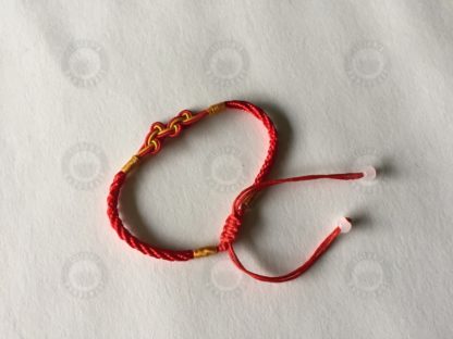 Red bracelet with lucky knot