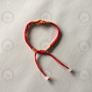 Red bracelet with lucky 8 shaped sign