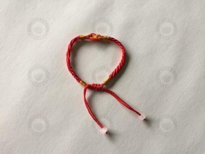 Red bracelet with lucky 8 shaped sign